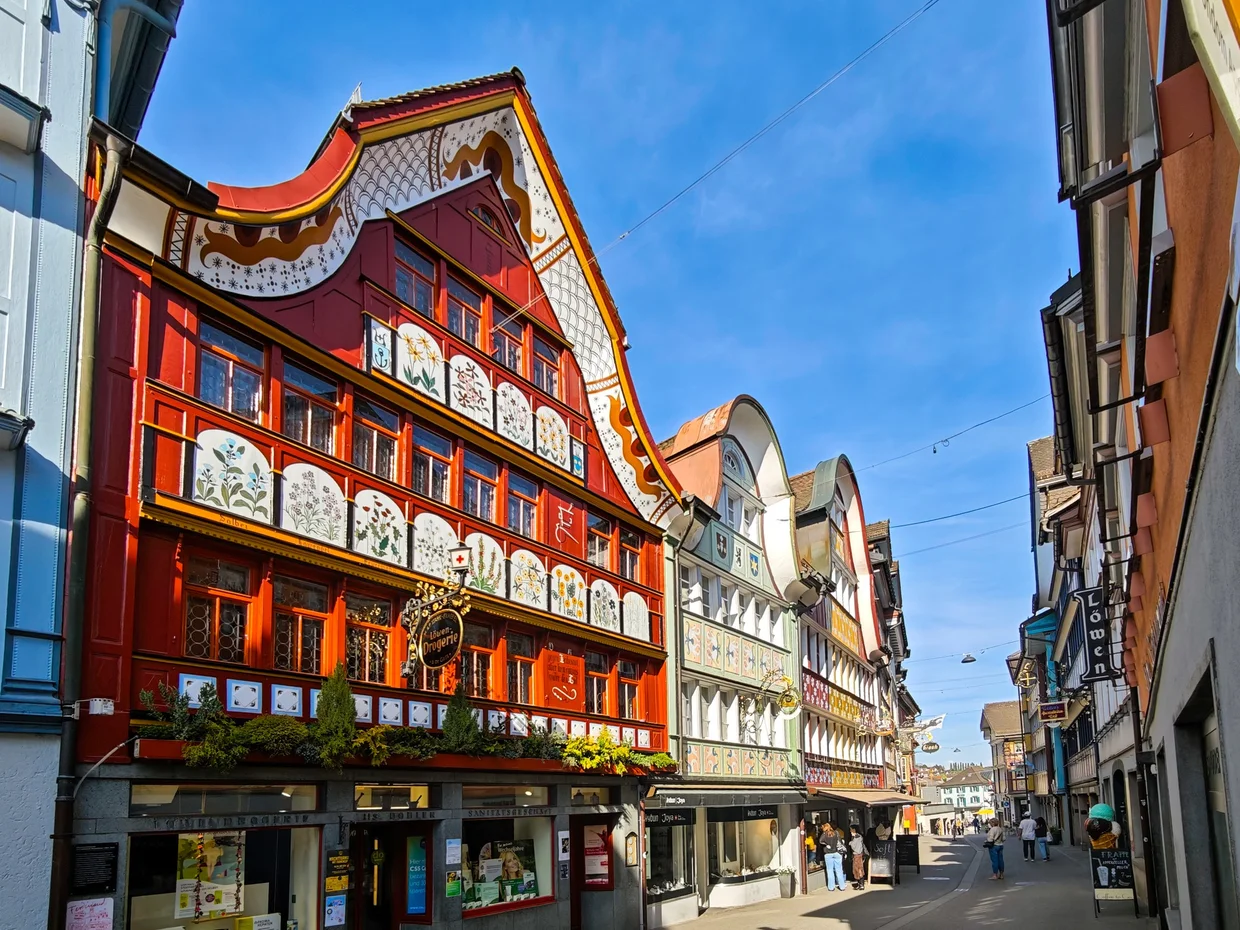 Famous orange and red painted facade on the Adler restaurant building