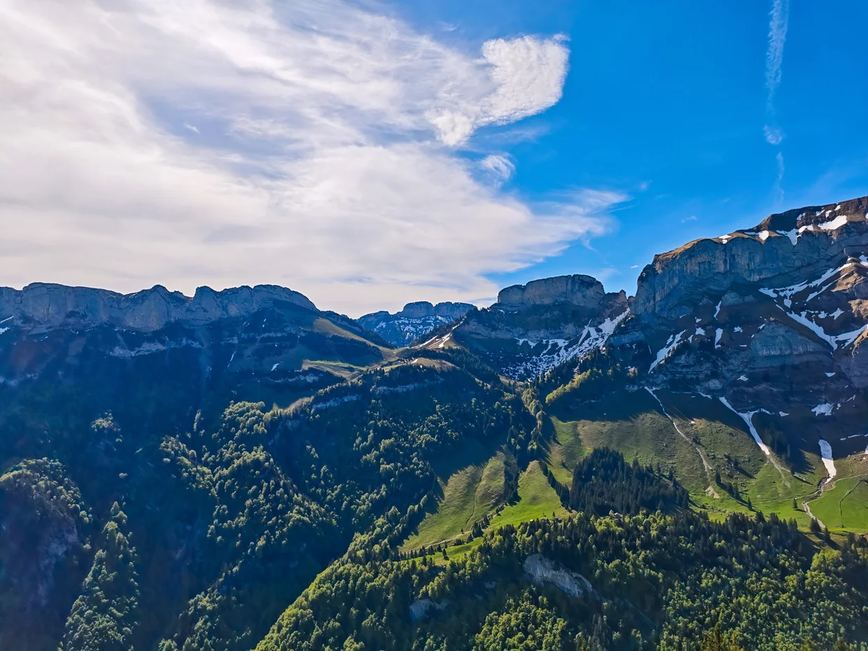 Alpstein limestone walls in early morning light, ridge upon ridge of peaks