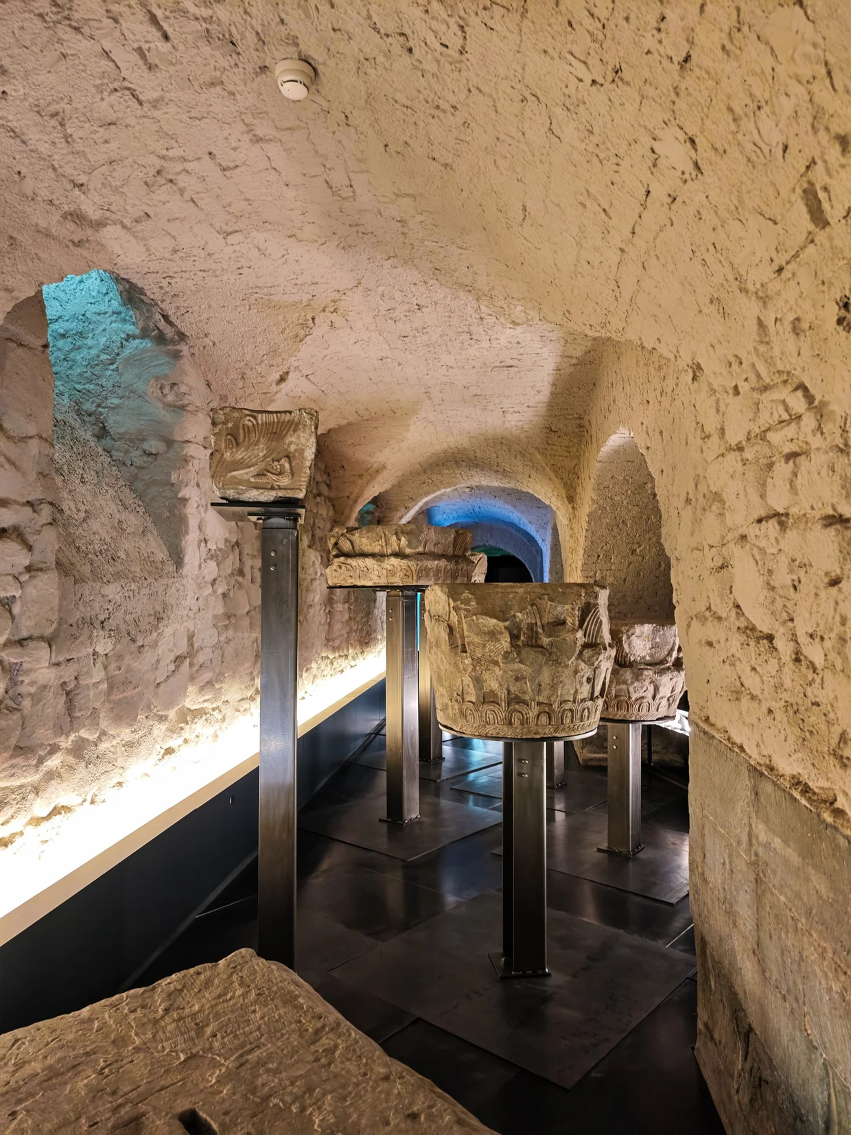 Whitewashed crypt with old carved stone columns