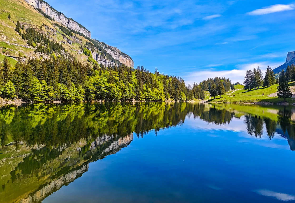 Seealpsee lying mirror-still under the Alpstein, the trip winding down
