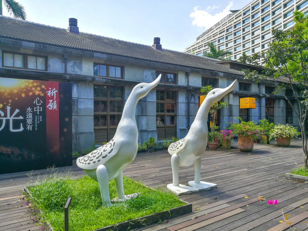 Bird sculptures outside a converted warehouse at Songshan