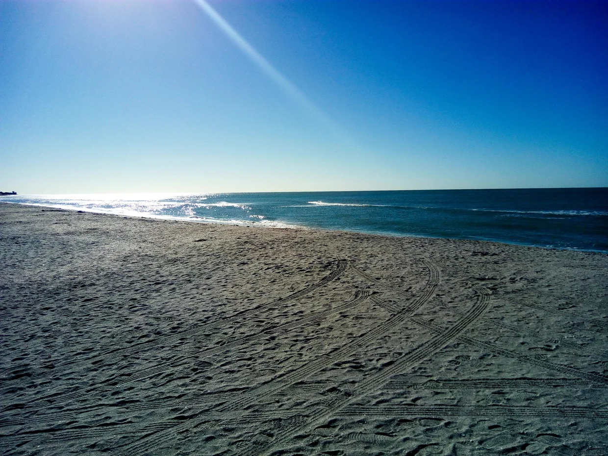 Wide sandy beach on a sunny day